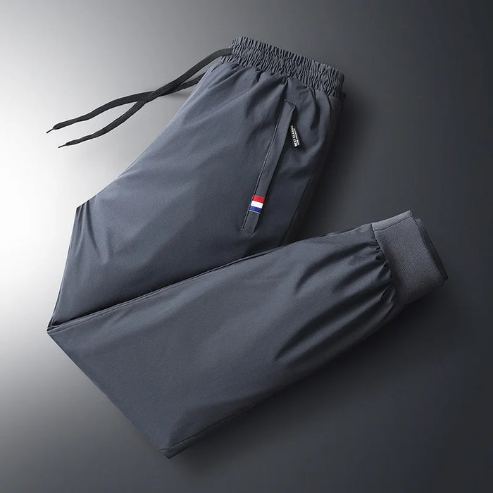 Autumn Pants Men's Elastic Waist Fitness Sportswear New Winter Waterproof and Warm Pants Men's Large Sized Loose Down Pants 7Xl